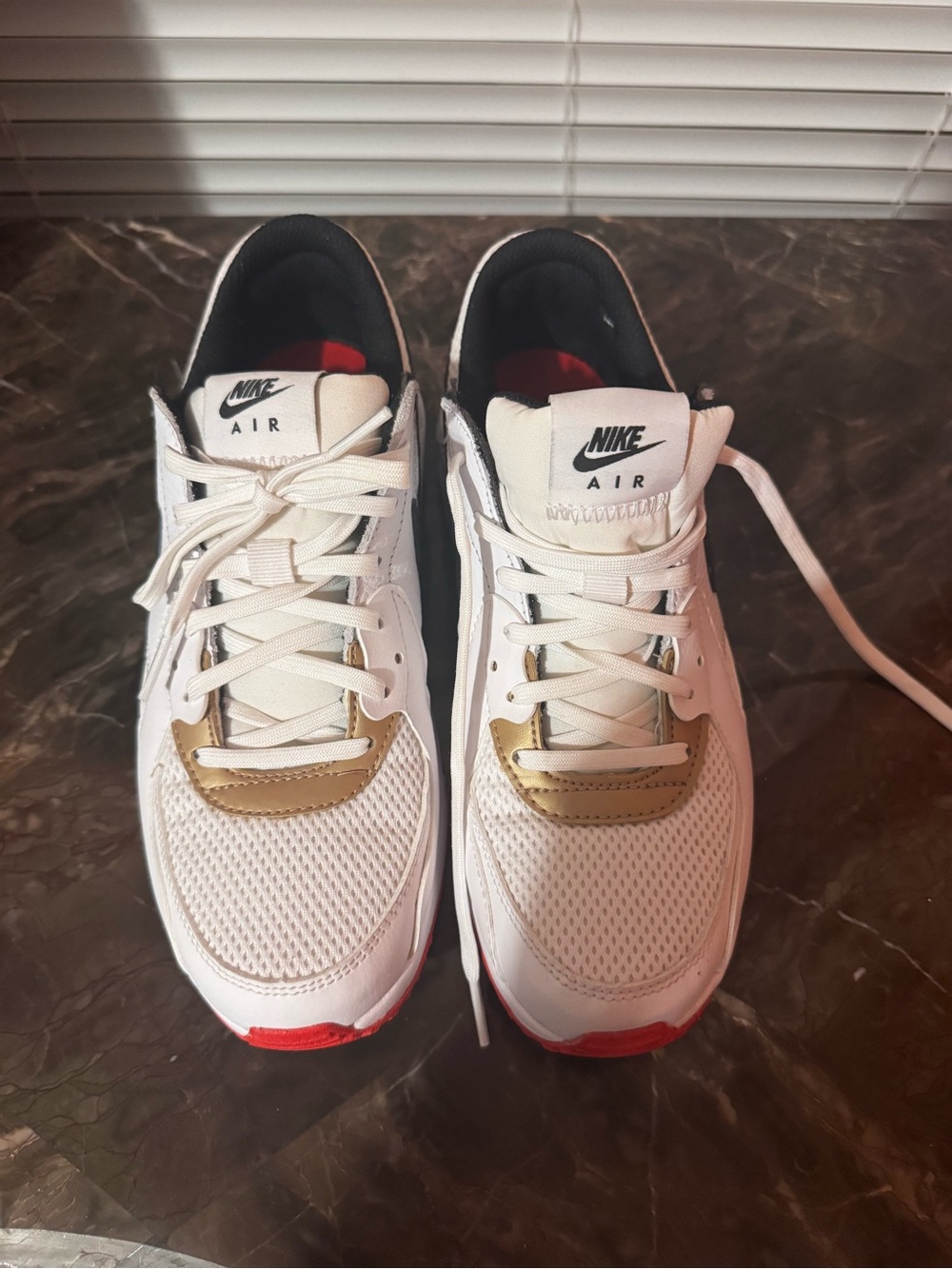 Nike Women's White Sneakers with Gold and Red Accents